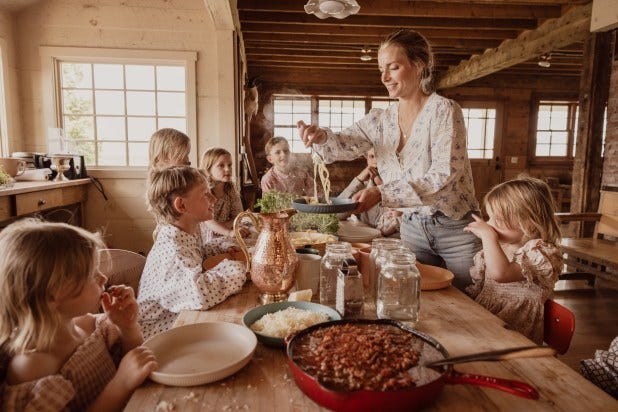 Selling beliefs as lifestyle pictured is large family eating traditional meal